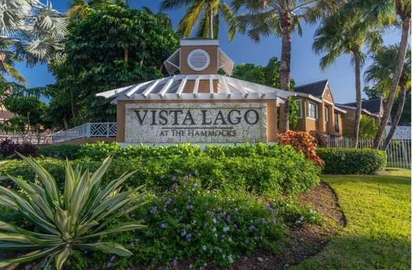 a view of a sign board with a big yard