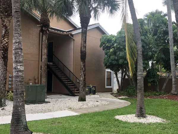 a view of a patio with a tree