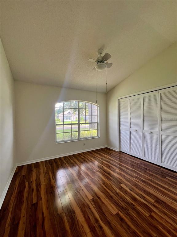 3515 Fox Squirrel Lane Valrico, FL 33596 - Photo 17 of 24 a view of an empty room with wooden floor and a window