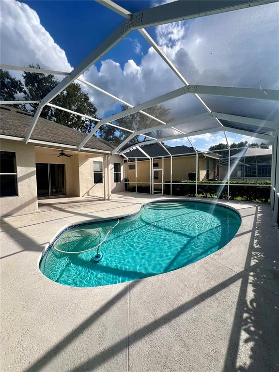 3515 Fox Squirrel Lane Valrico, FL 33596 - Photo 22 of 24 a view of a swimming pool with a garden