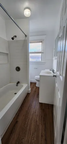 a bathroom with a sink a bathtub and a shower