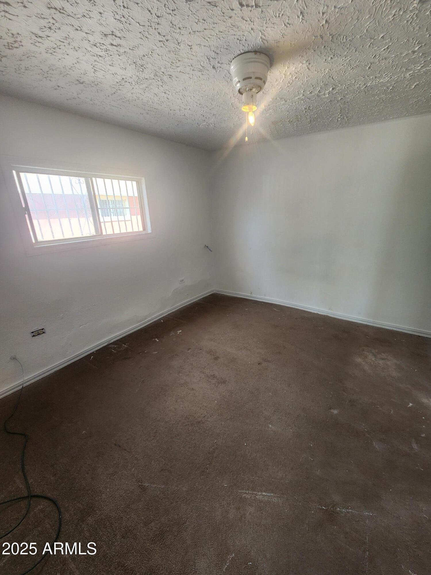 730 1st Street Douglas, AZ 85607 - Photo 7 of 13 a view of an empty room and window