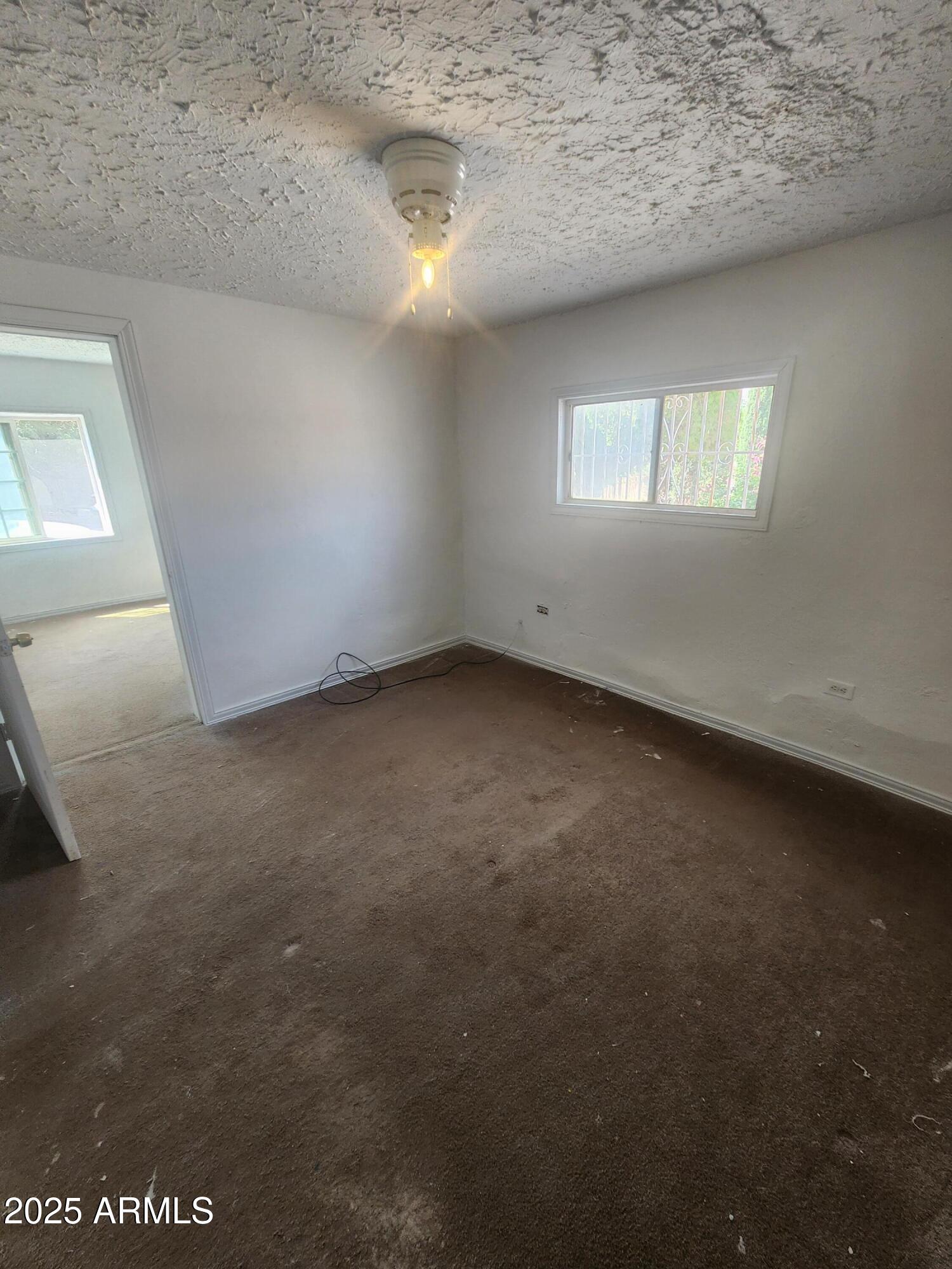 730 1st Street Douglas, AZ 85607 - Photo 8 of 13 a view of an empty room with a window