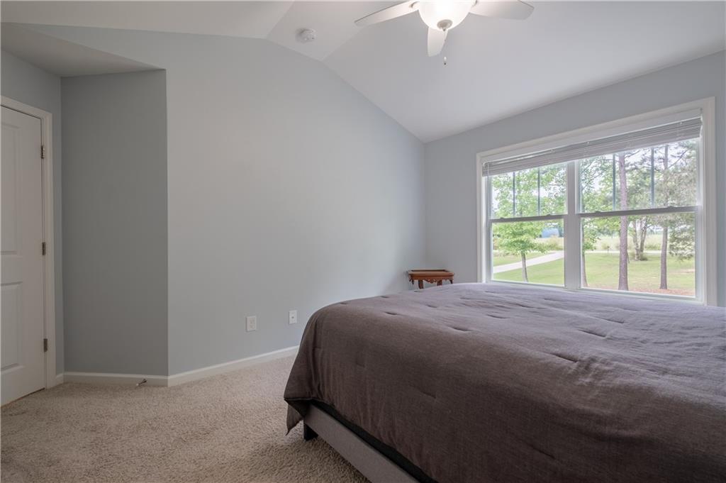 719 Fairview Road Brooks, GA 30205 - Photo 21 of 35 a bed sitting in a bedroom next to a window