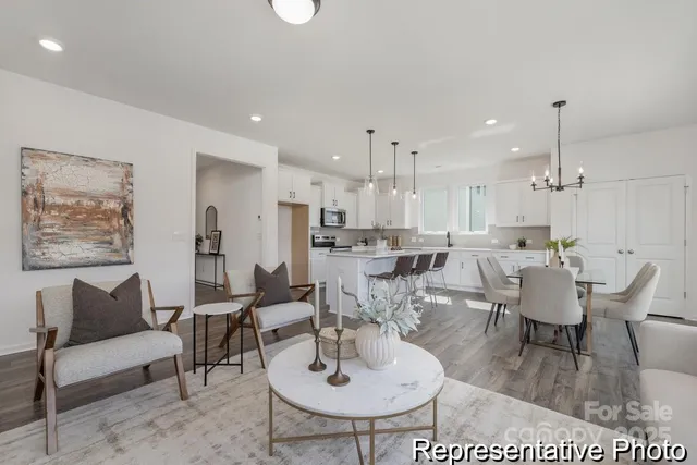 a living room with lots of furniture and a dining table