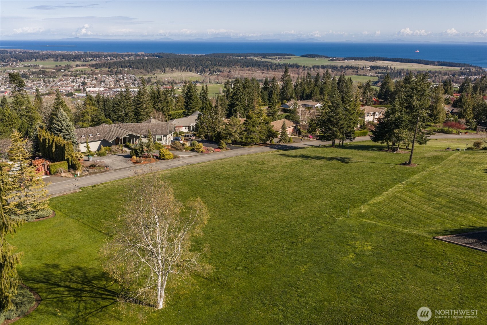a view of a swimming pool with an ocean view