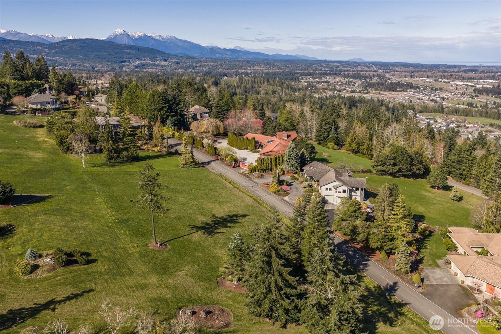 9999 Fawn Lane Sequim, WA 98382 - Photo 13 of 28 a view of a city with mountains in the background