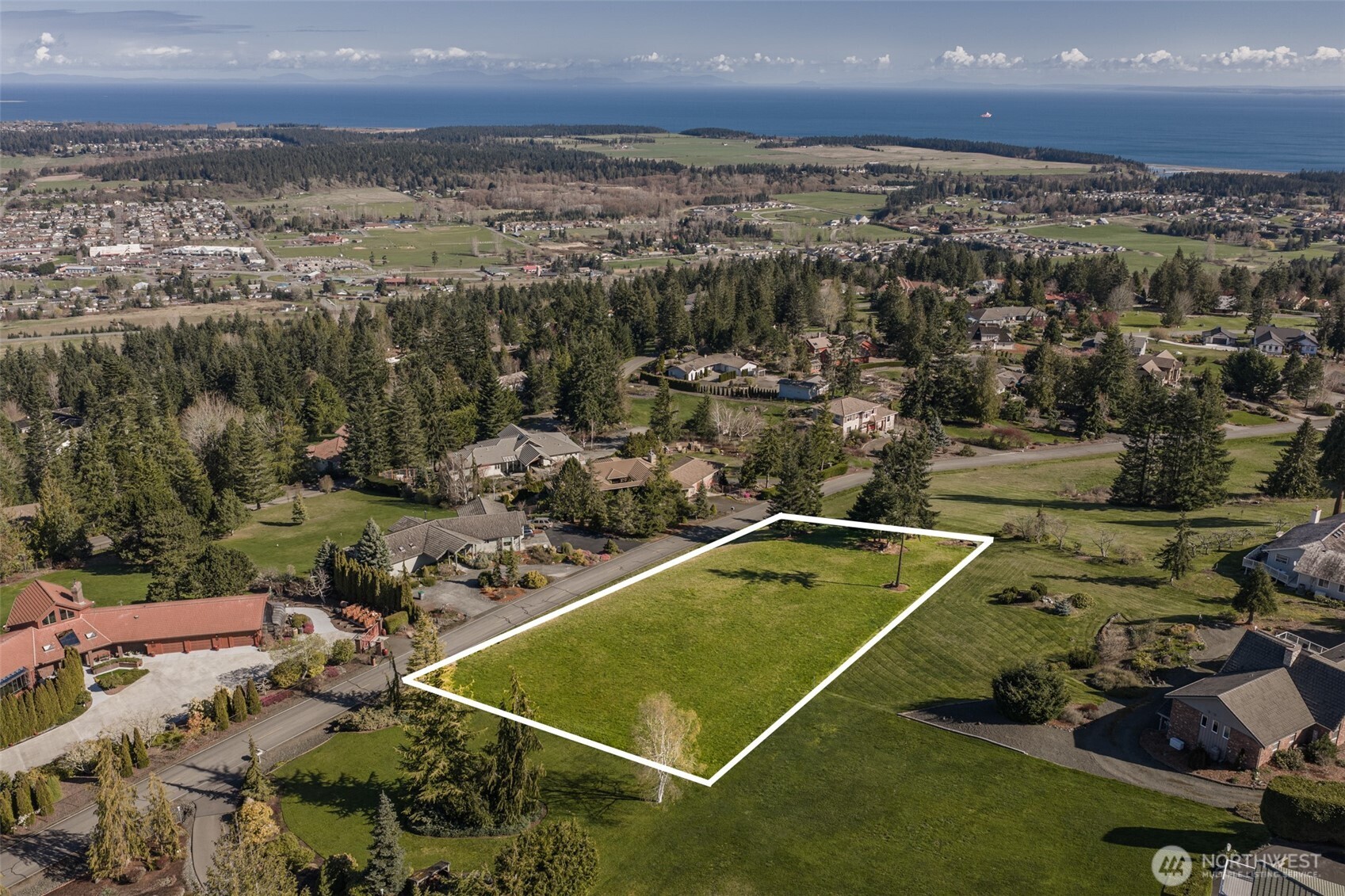 9999 Fawn Lane Sequim, WA 98382 - Photo 2 of 28 an aerial view of a house with a swimming pool and outdoor space