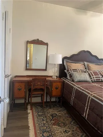 a bedroom with a bed and a dresser