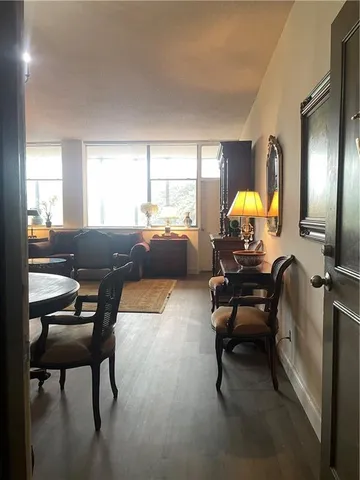 a living room filled with furniture and a chandelier