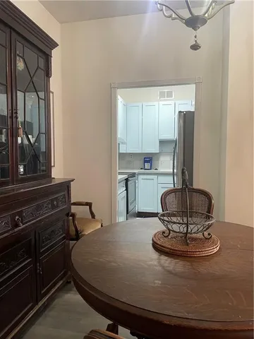 a kitchen with a table and chairs