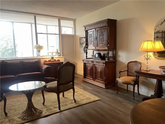a view of a livingroom with furniture and a window