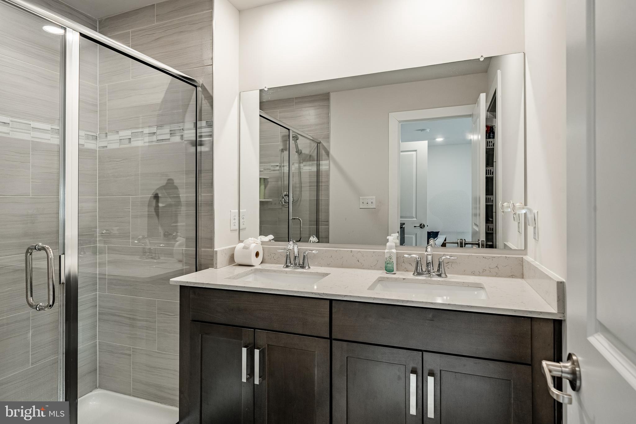 228 Red Leaf Lane Exton, PA 19341 - Photo 17 of 26 a bathroom with a double vanity sink mirror and double