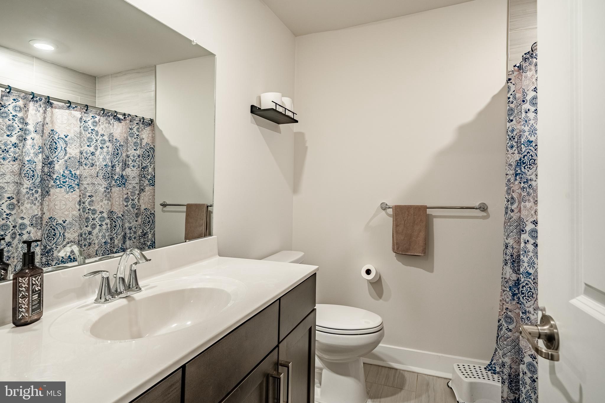 228 Red Leaf Lane Exton, PA 19341 - Photo 20 of 26 a bathroom with a sink toilet and shower