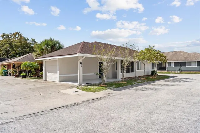 a view of a house next to a yard and road