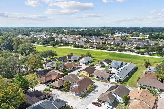 an aerial view of a houses with a lake view