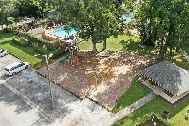 a backyard of a house with table and chairs