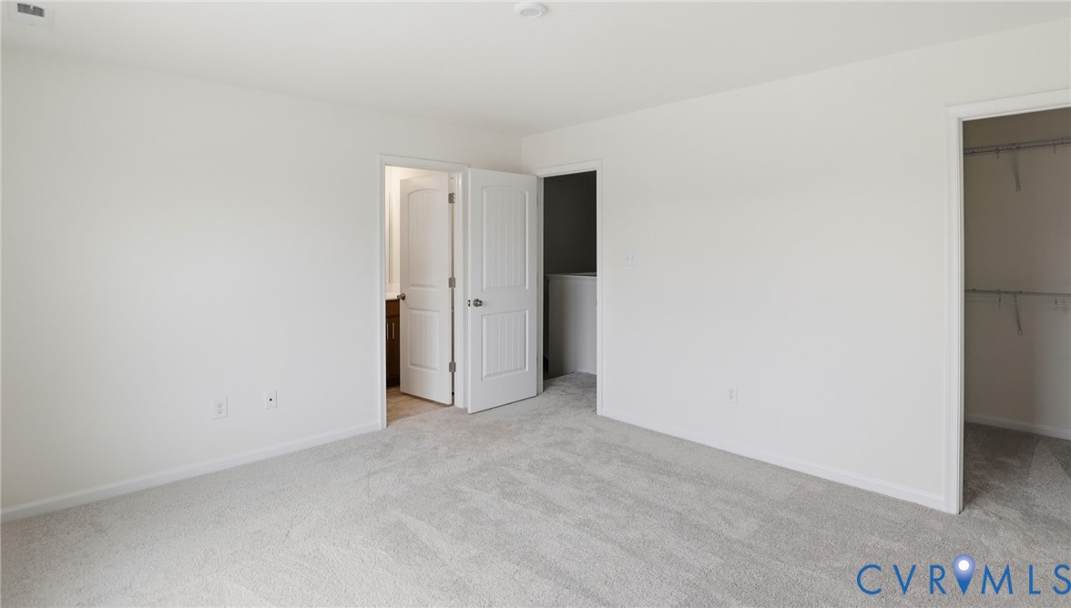 6531 Topsail Point Richmond, VA 23234 - Photo 15 of 35 Upstairs, you'll find the first primary suite, fe