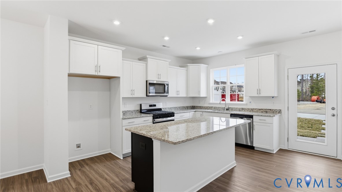 6531 Topsail Point Richmond, VA 23234 - Photo 2 of 35 The gourmet kitchen includes crisp white cabinets,