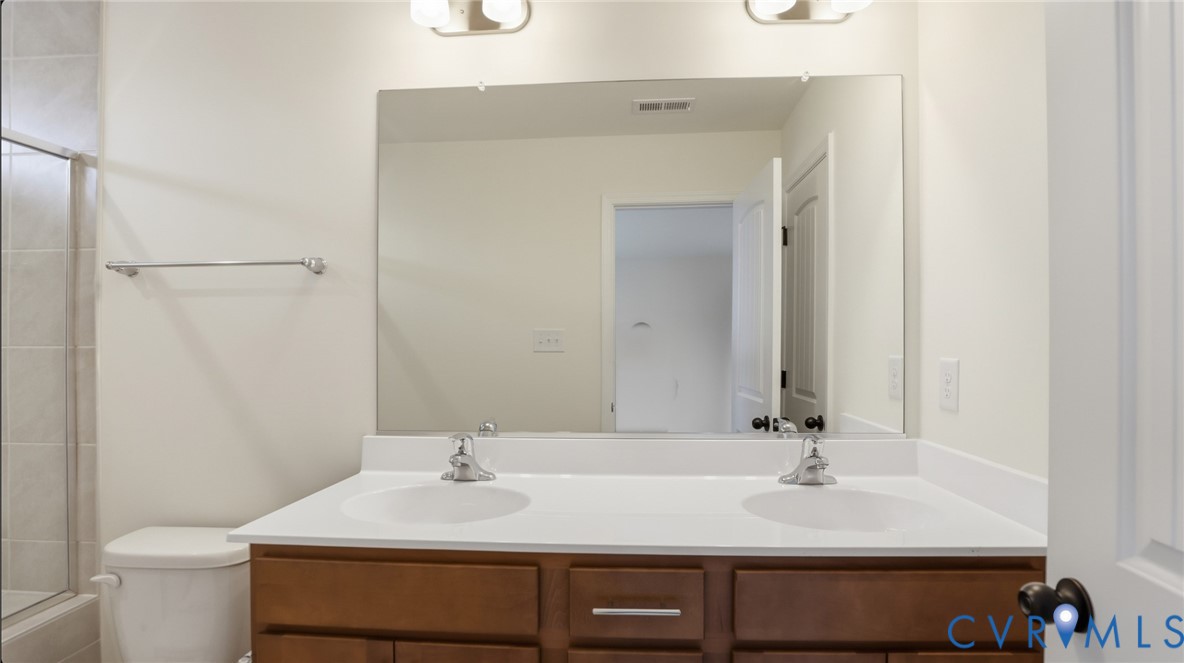 6531 Topsail Point Richmond, VA 23234 - Photo 21 of 35 Upstairs, you'll find the first primary suite, fea