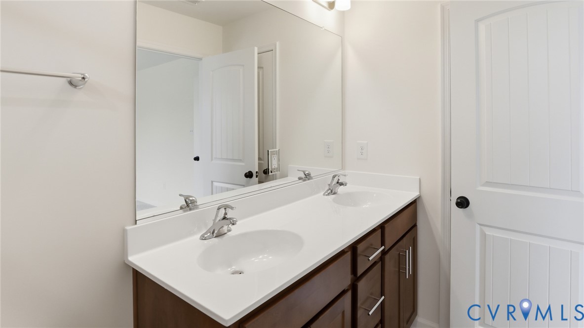 6531 Topsail Point Richmond, VA 23234 - Photo 22 of 35 Upstairs, you'll find the first primary suite, fea