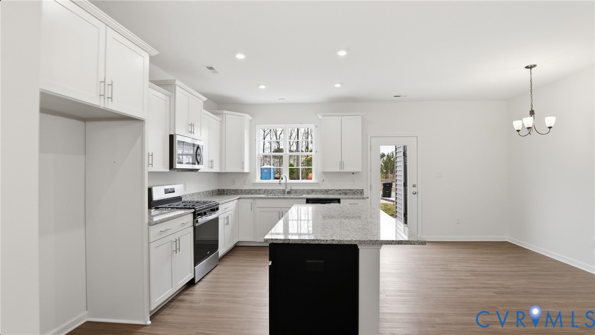 6531 Topsail Point Richmond, VA 23234 - Photo 7 of 35 The gourmet kitchen includes crisp white cabinets,