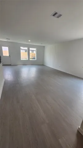 a view of storage and utility room with cabinets