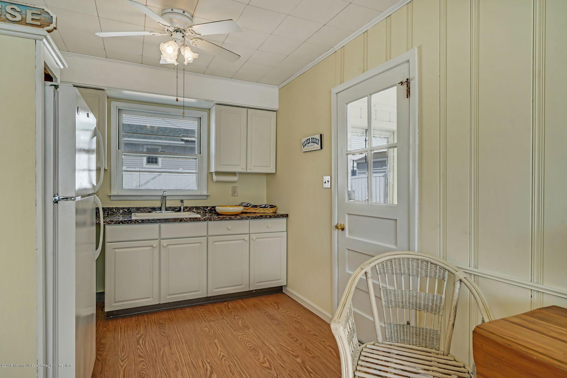 124 South Bayside Road Lavallette, NJ 08735 - Photo 14 of 26 a bathroom with a sink a mirror and a bathtub