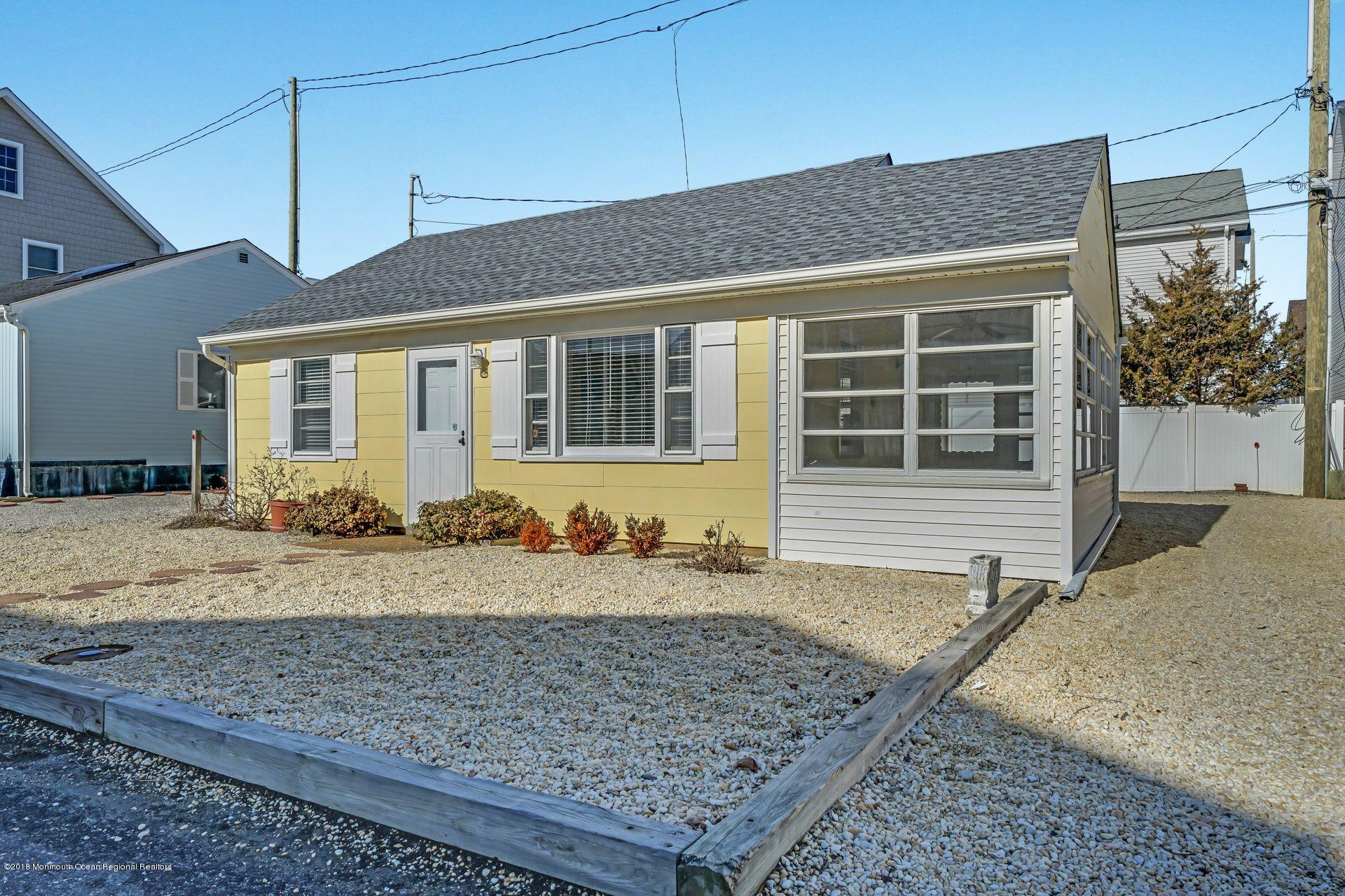 124 South Bayside Road Lavallette, NJ 08735 - Photo 17 of 26 a front view of a house with garden