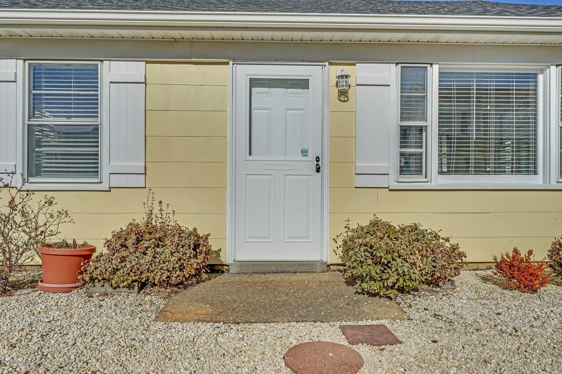124 South Bayside Road Lavallette, NJ 08735 - Photo 18 of 26 a view of a door and chair