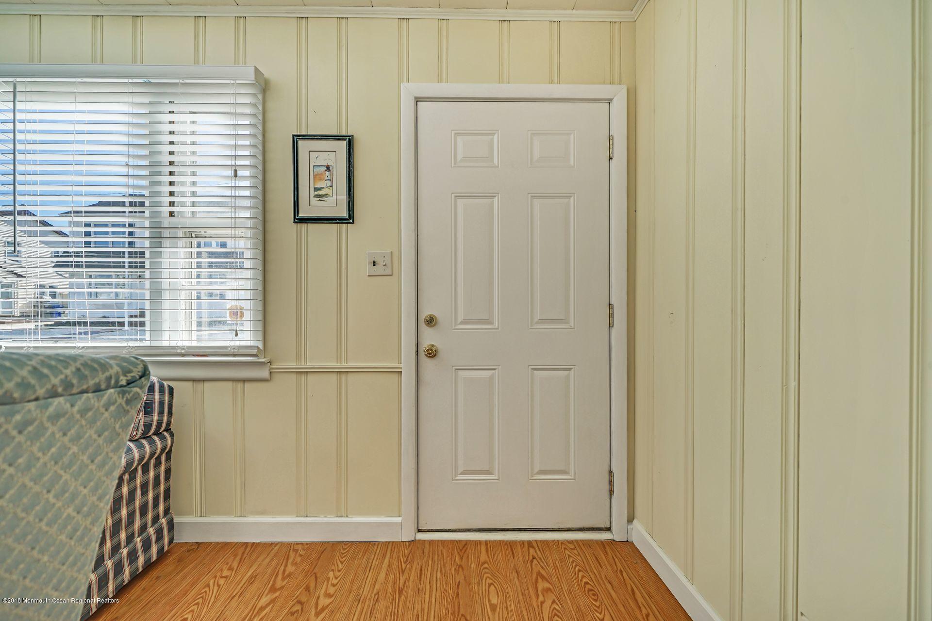 124 South Bayside Road Lavallette, NJ 08735 - Photo 3 of 26 a view of front door with hallway