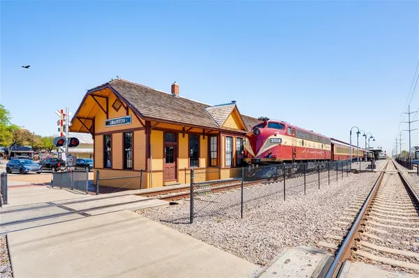a view of an chairs and tables in the balcony
