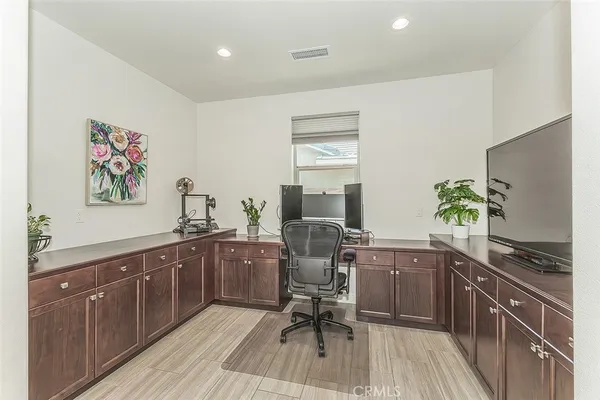 a bathroom with a granite countertop sink a mirror and a