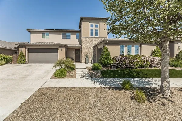 front view of a house with a small yard