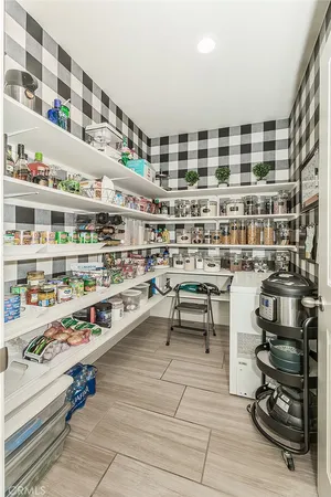 a view of a hallway with wooden floor and entryway