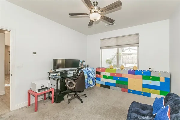 a spacious bathroom with a granite countertop sink and a mirror