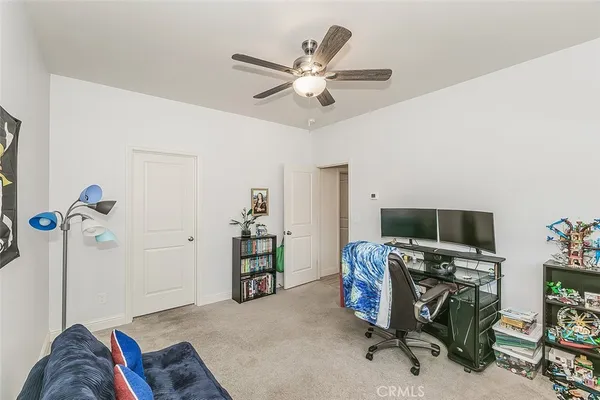 a kitchen with granite countertop cabinets and wooden floor