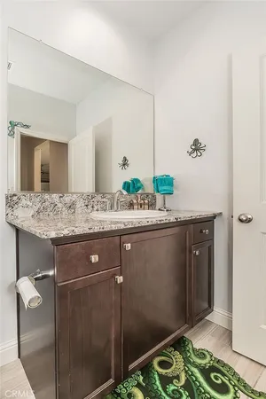 a living room with lots of furniture and air hockey table