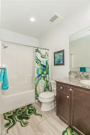 a view of walk in closet with clothes