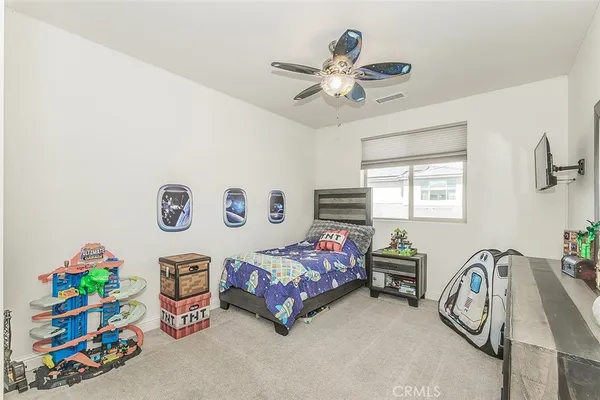a view of a patio with couches and table and chairs with potted plants