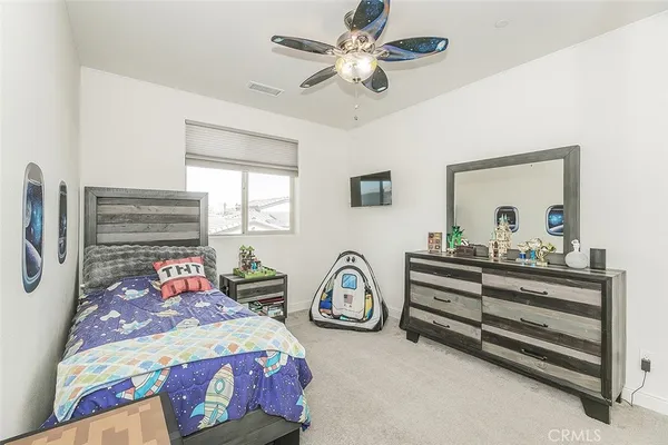 a view of the patio with dining table and chairs