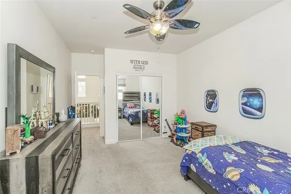 a view of a patio with couches table and chairs and potted plants