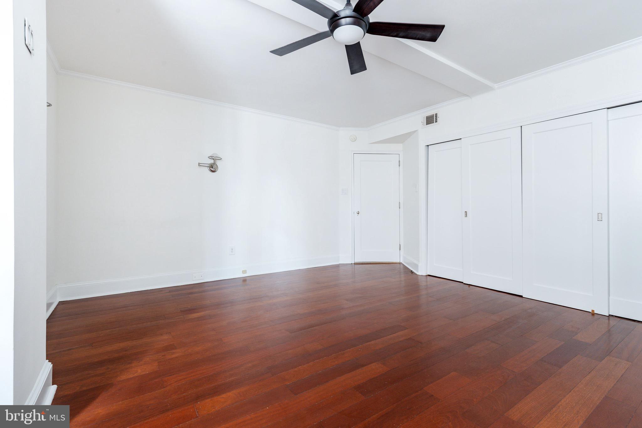 1901 Walnut Street, Unit 5E Philadelphia, PA 19103 - Photo 11 of 28 wooden floor in an empty room