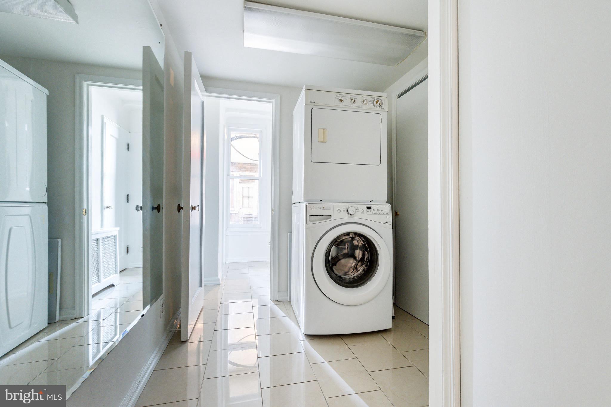 1901 Walnut Street, Unit 5E Philadelphia, PA 19103 - Photo 19 of 28 a view of a hallway with washer and dryer