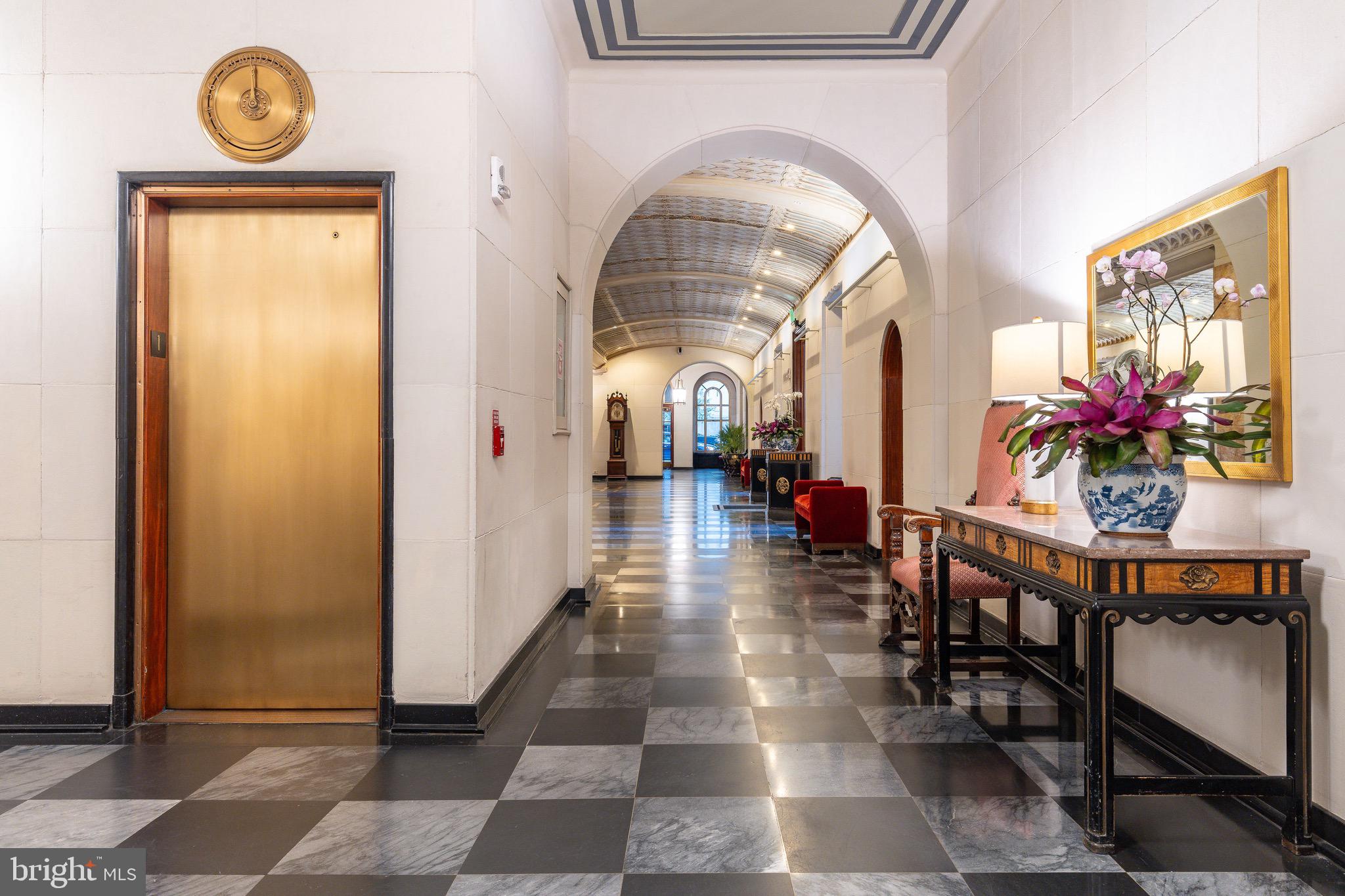 1901 Walnut Street, Unit 5E Philadelphia, PA 19103 - Photo 3 of 28 a lobby with a table and a chandelier