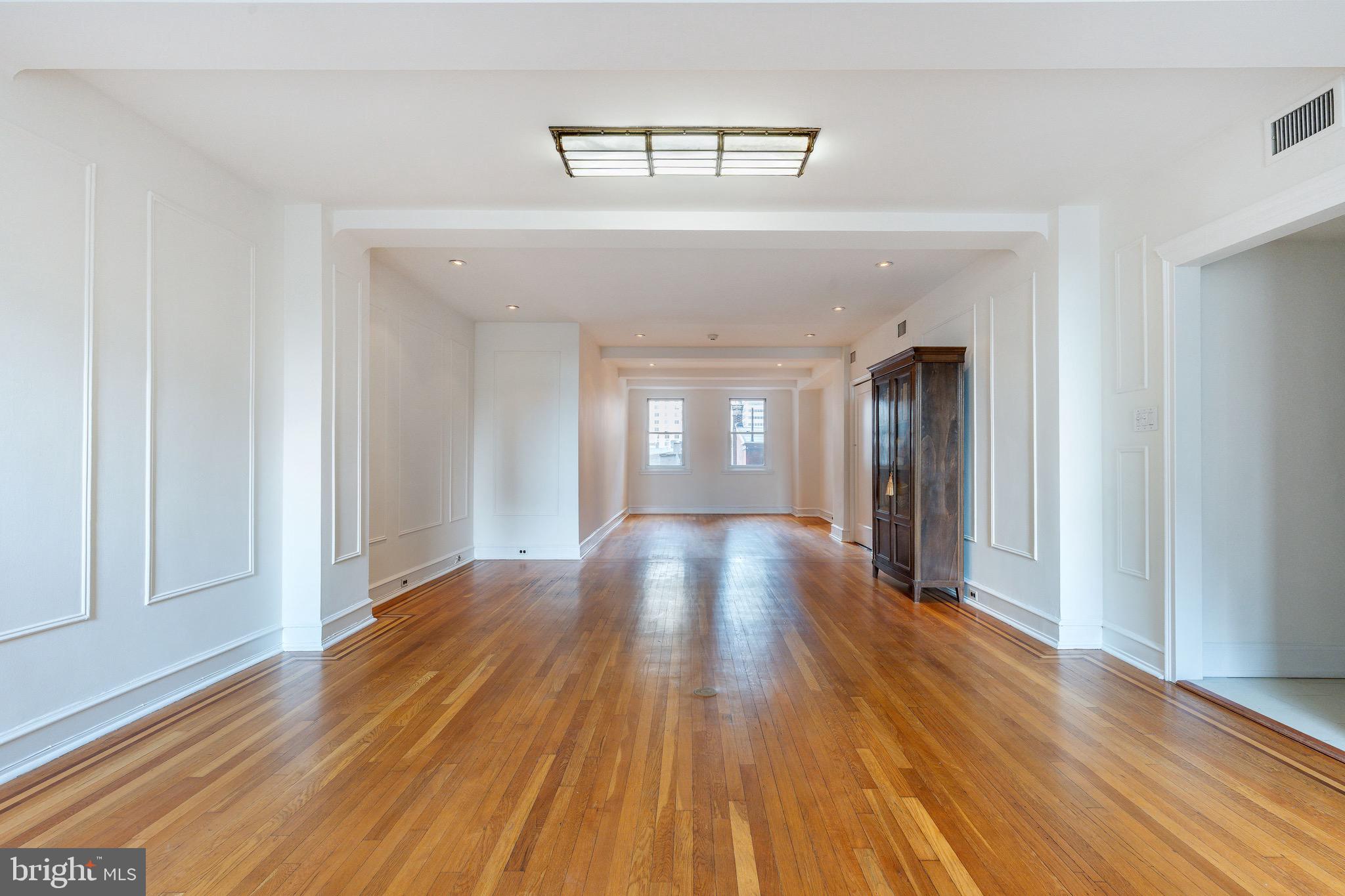 1901 Walnut Street, Unit 5E Philadelphia, PA 19103 - Photo 10 of 28 wooden floor in an empty room with a window