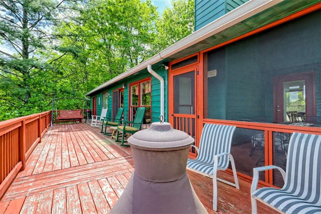 995 Glassy Mountain Road Hiawassee, GA 30546 - Photo 20 of 87 a view of a patio with a table and chairs