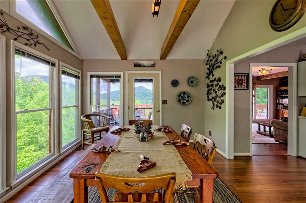 995 Glassy Mountain Road Hiawassee, GA 30546 - Photo 28 of 87 a view of a dining room with furniture window and wooden floor