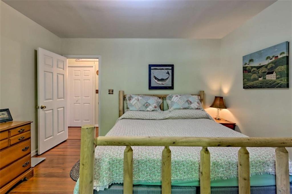 995 Glassy Mountain Road Hiawassee, GA 30546 - Photo 47 of 87 a bedroom with a bed and a large window