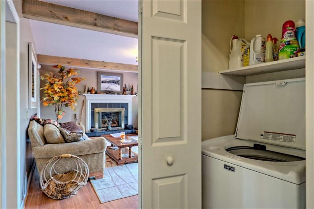 995 Glassy Mountain Road Hiawassee, GA 30546 - Photo 50 of 87 a living room with furniture and a fireplace